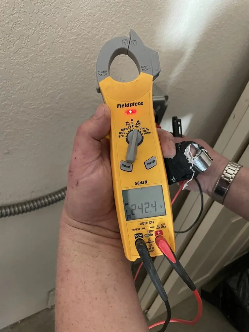Voltage testing with clamp meter during Ceiling Fan Installation in Seffner